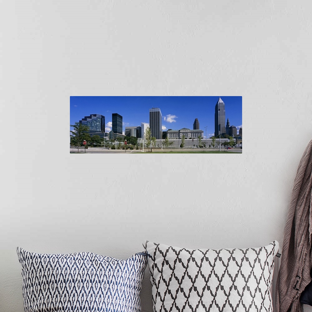 A bohemian room featuring Panoramic photograph taken of the Cleveland skyline on a bright sunny day.