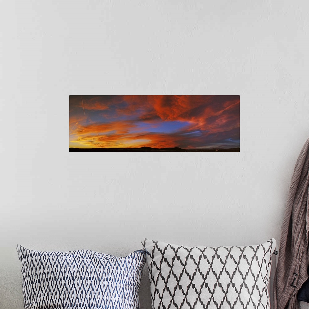 A bohemian room featuring Clouds in the sky at sunset, Taos, Taos County, New Mexico, USA