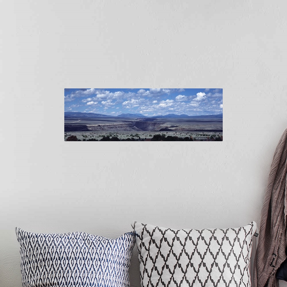 A bohemian room featuring Clouds over a landscape, Rio Grande Gorge, Taos, New Mexico