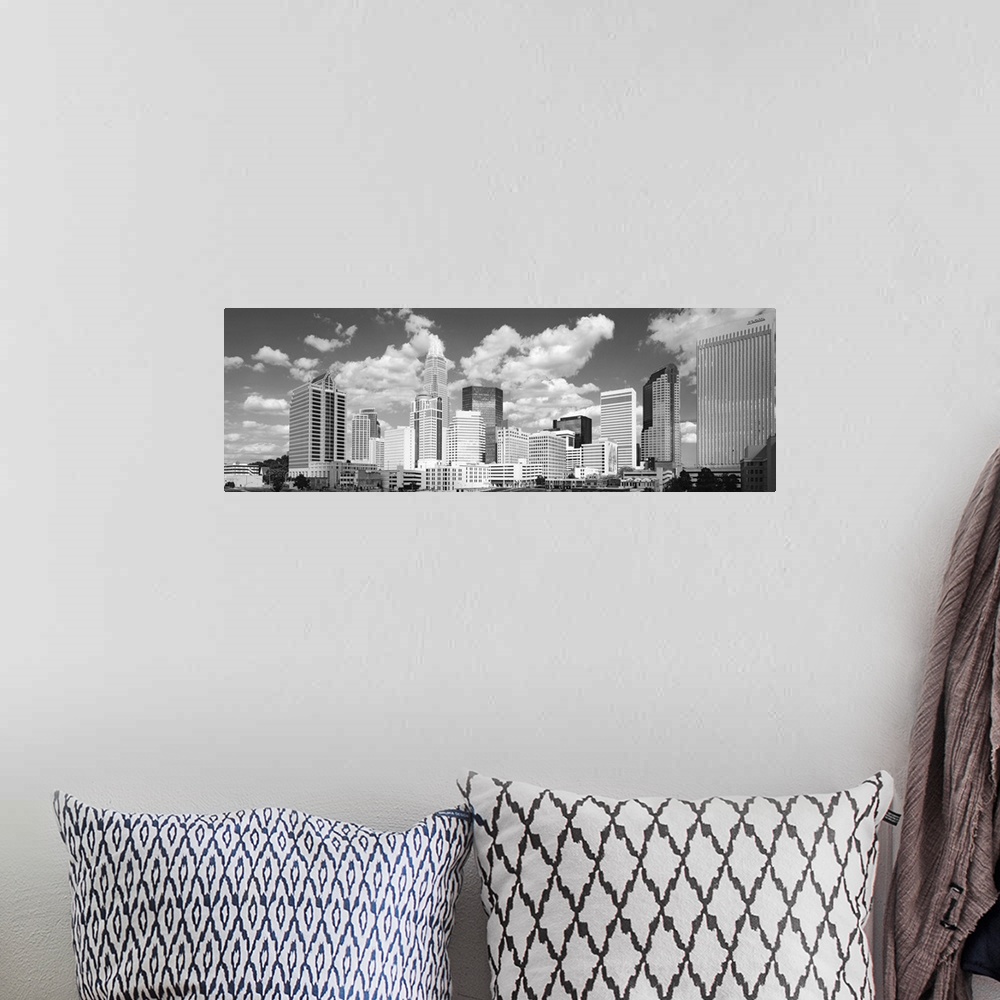 A bohemian room featuring Black and white photograph of the city skyline of Charlotte, North Carolina.