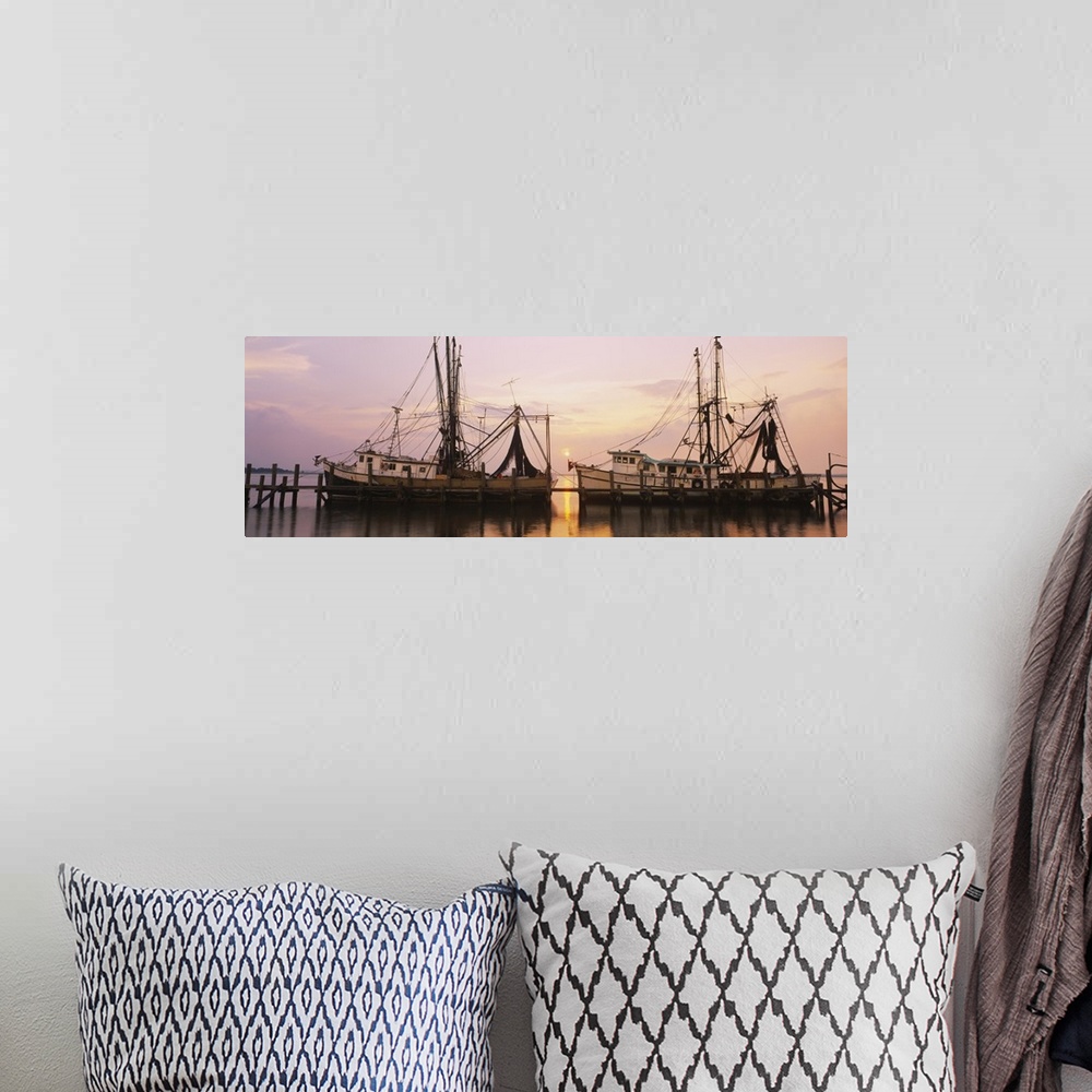 A bohemian room featuring Wide angle photograph of two large fishing boats anchored alongside a dock in the Amelia River, a...