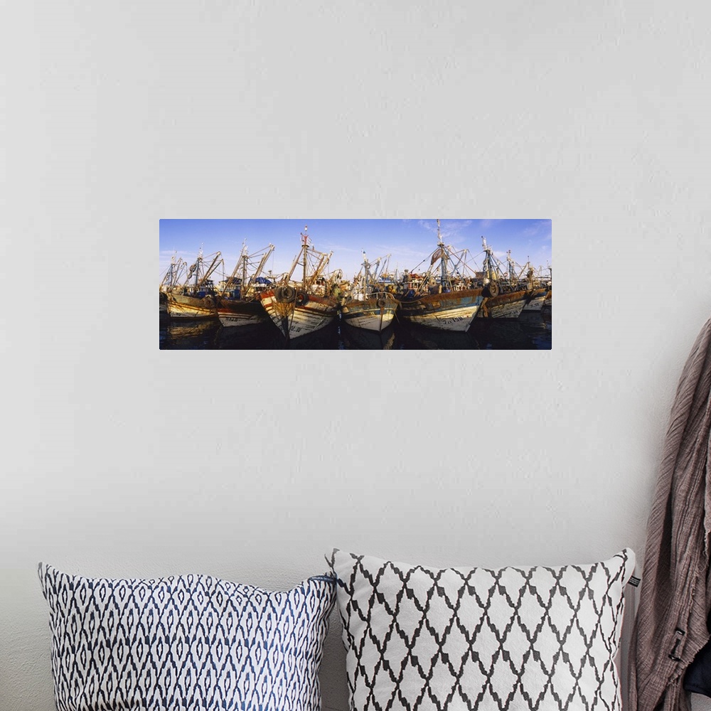 A bohemian room featuring Fishing boats moored at a harbor, Essaouira, Morocco