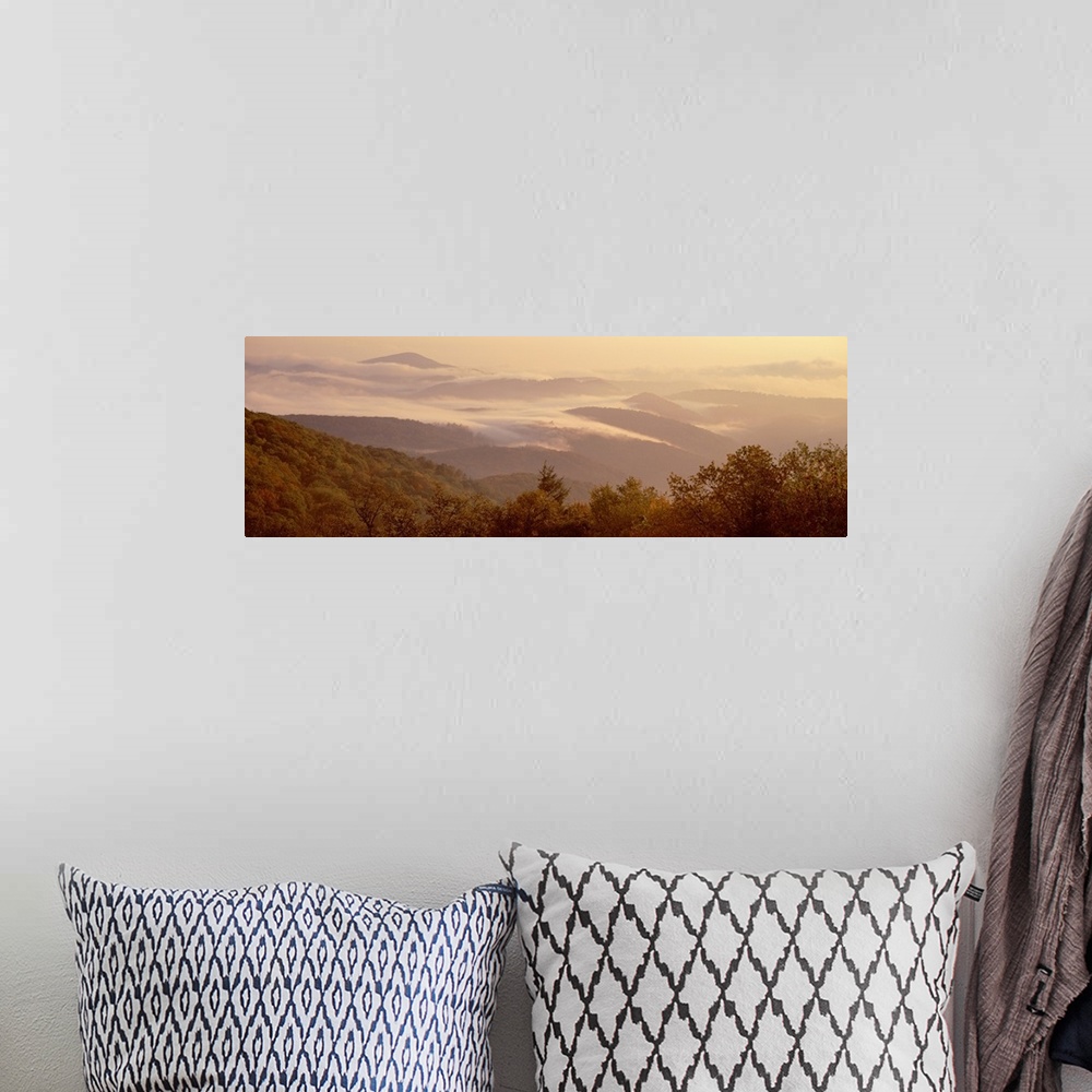 A bohemian room featuring View from the Blue Ridge Parkway of a foggy sunrise over a mountain range in North Carolina.