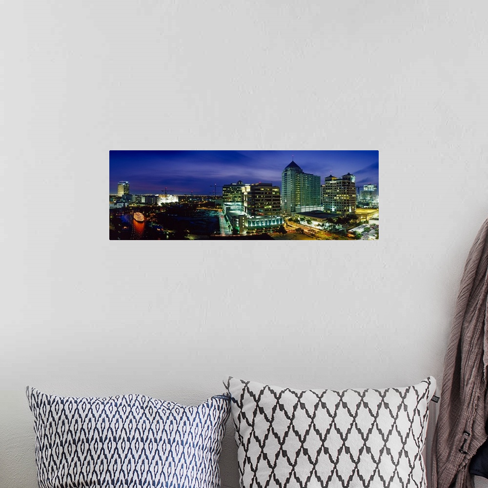 A bohemian room featuring Parts of the city of Ft. Lauderdale are illuminated under a night sky and shown in panoramic view.