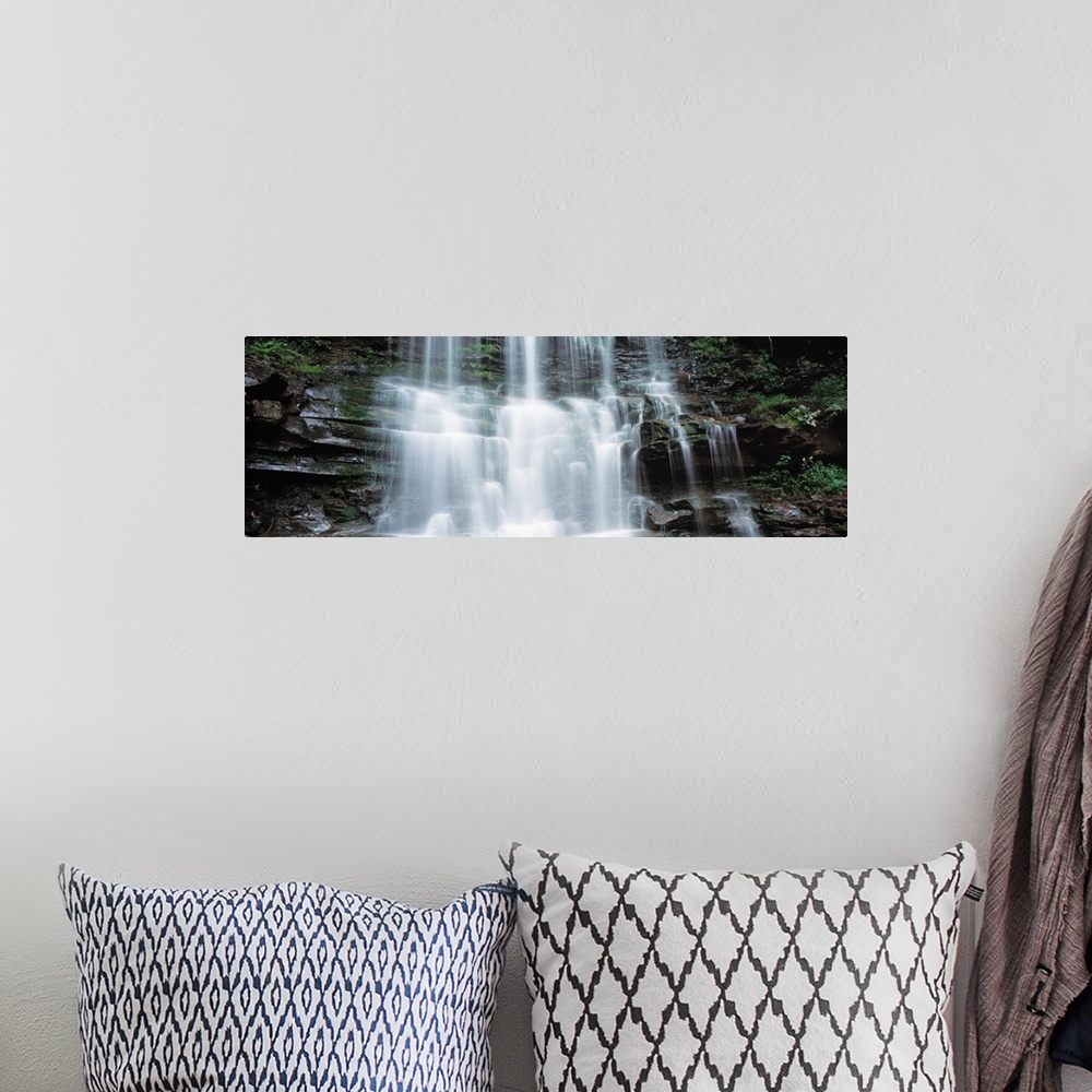 A bohemian room featuring Panoramic photo on canvas of water rushing down a rocky cliff in Pennsylvania.