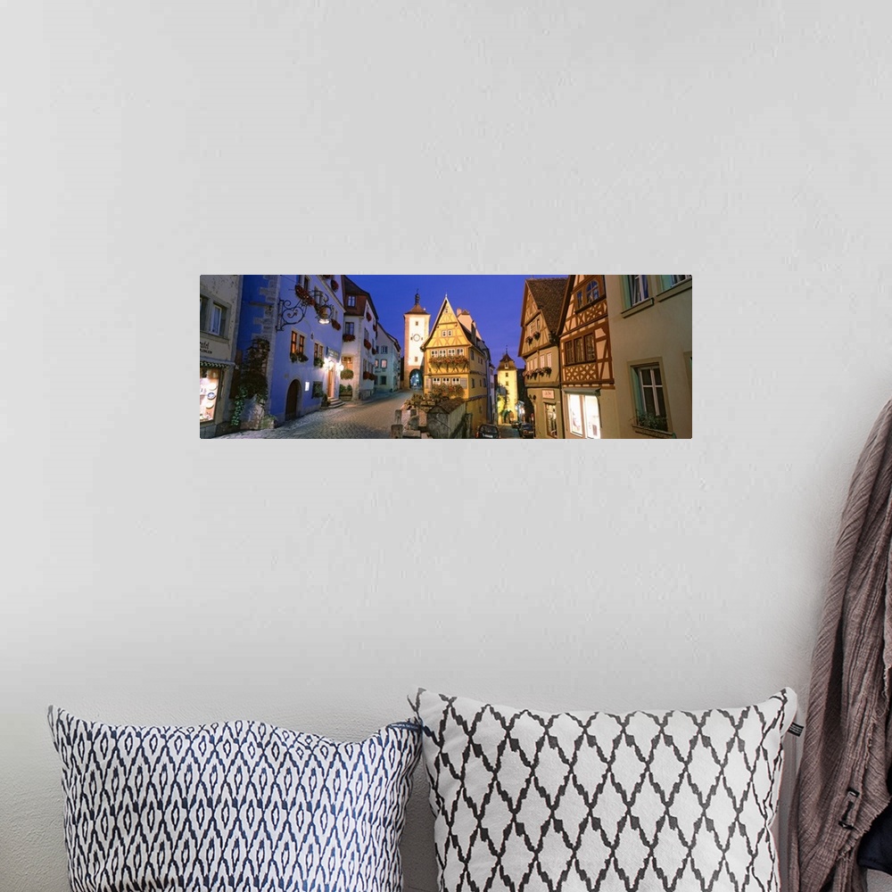 A bohemian room featuring Panoramic photograph looking down two brick roadways between rows of  German buildings, in Rothen...