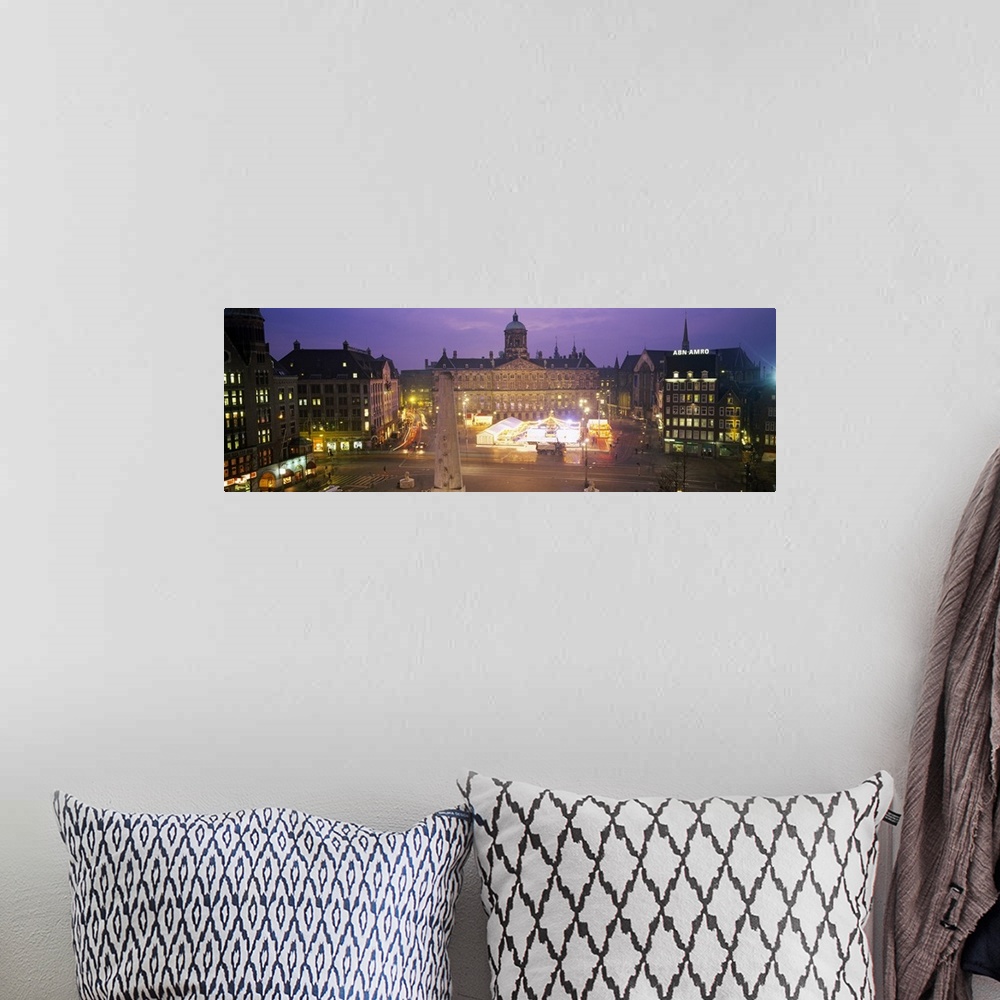 A bohemian room featuring High angle view of a town square lit up at dusk, Dam Square, Amsterdam, Netherlands