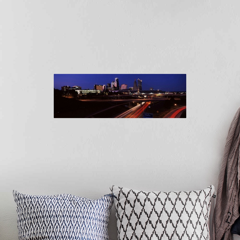 A bohemian room featuring Highway interchange and skyline at dusk, Kansas City, Missouri, USA