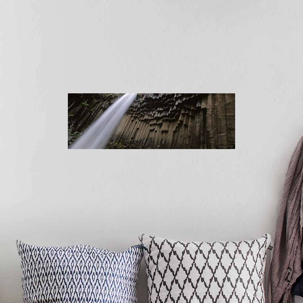 A bohemian room featuring Iceland, Skaftafell National Park, Svartifoss Waterfall, Water flowing from the cliff