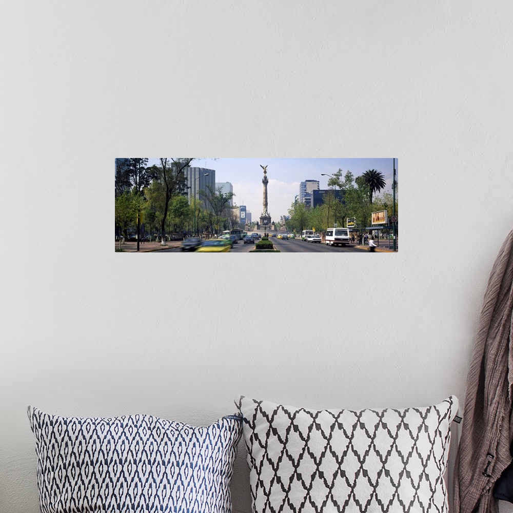 A bohemian room featuring Traffic on road with victory column, Independence Monument, Independence Circle, Paseso Del La Re...