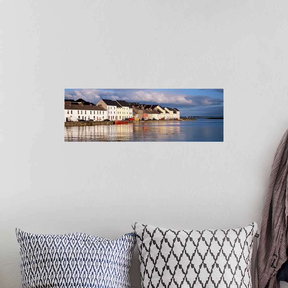 A bohemian room featuring Long horizontal photo print of colorful Irish buildings and houses along the waterfront.