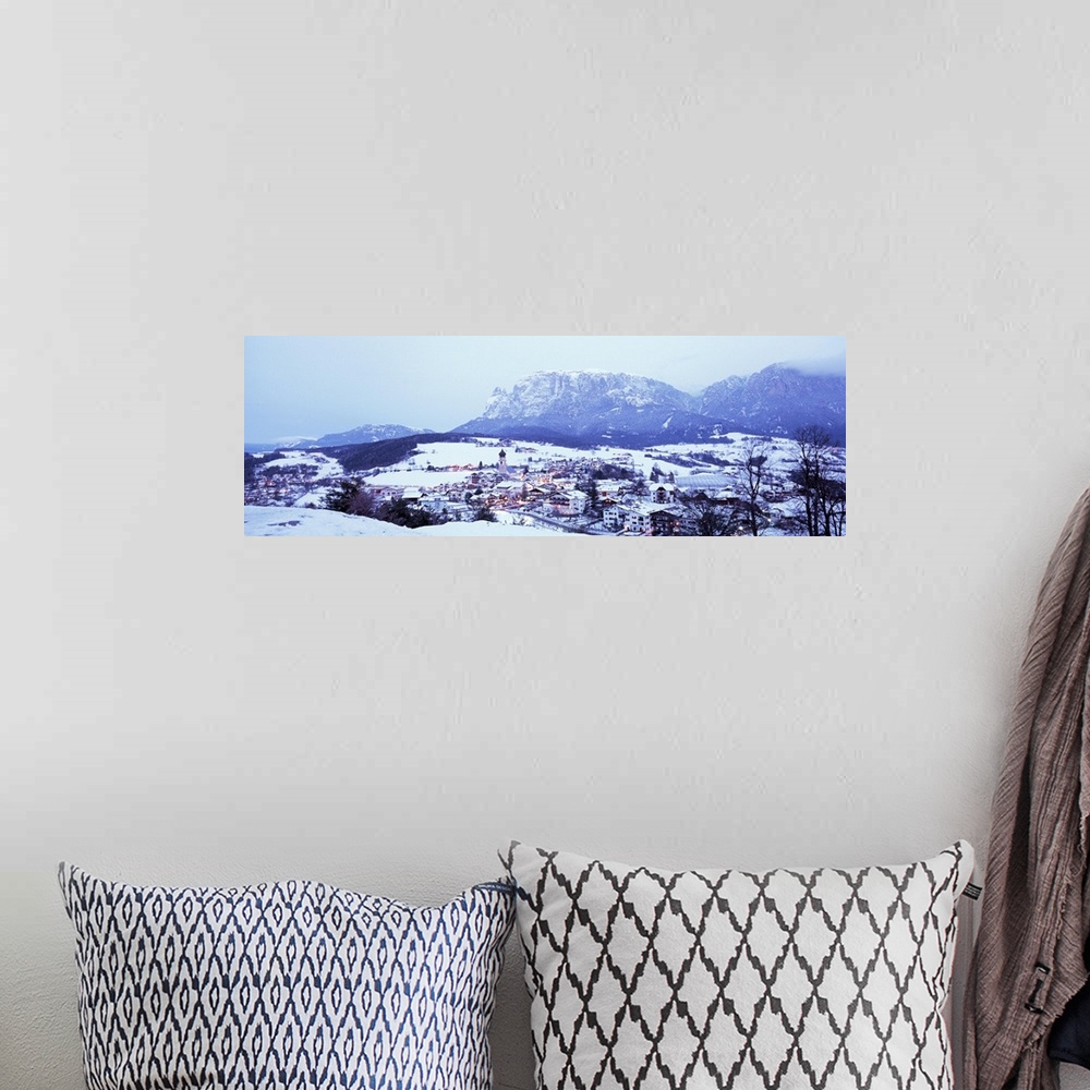 A bohemian room featuring Italy, Fie, Italian Alps, High angle view of town covered with snow