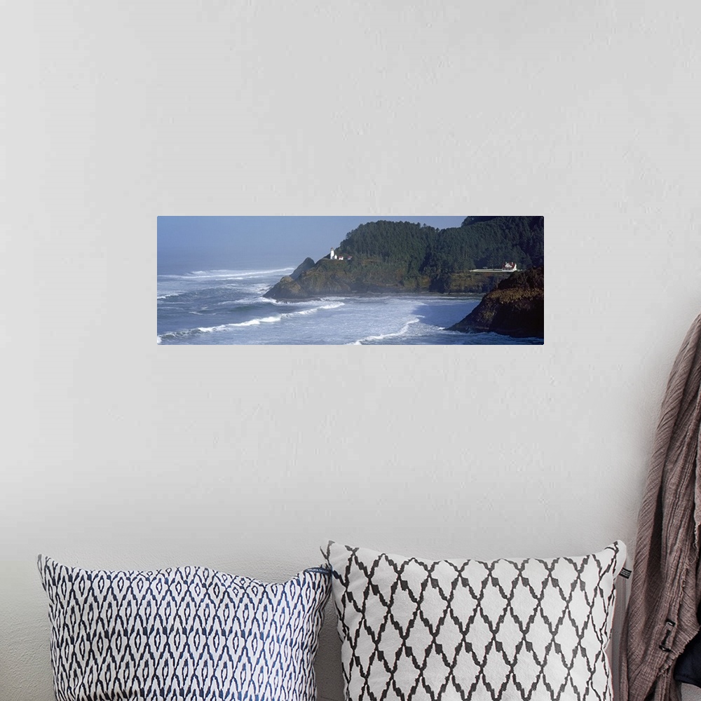 A bohemian room featuring Large, landscape photograph of waves rushing against the shore in Heceta Head, Lane County, Orego...