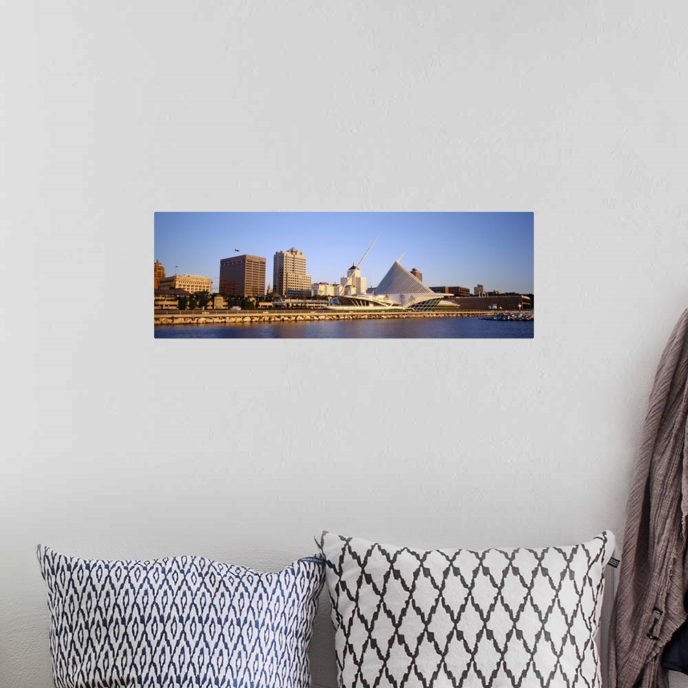 A bohemian room featuring Panoramic photograph on a big canvas of buildings on the water in Milwaukee, Wisconsin, including...