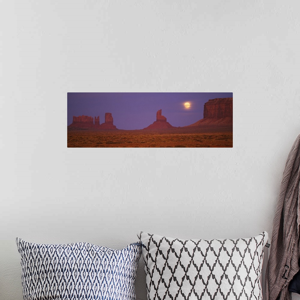 A bohemian room featuring Moon shining over rock formations, Monument Valley Tribal Park, Arizona