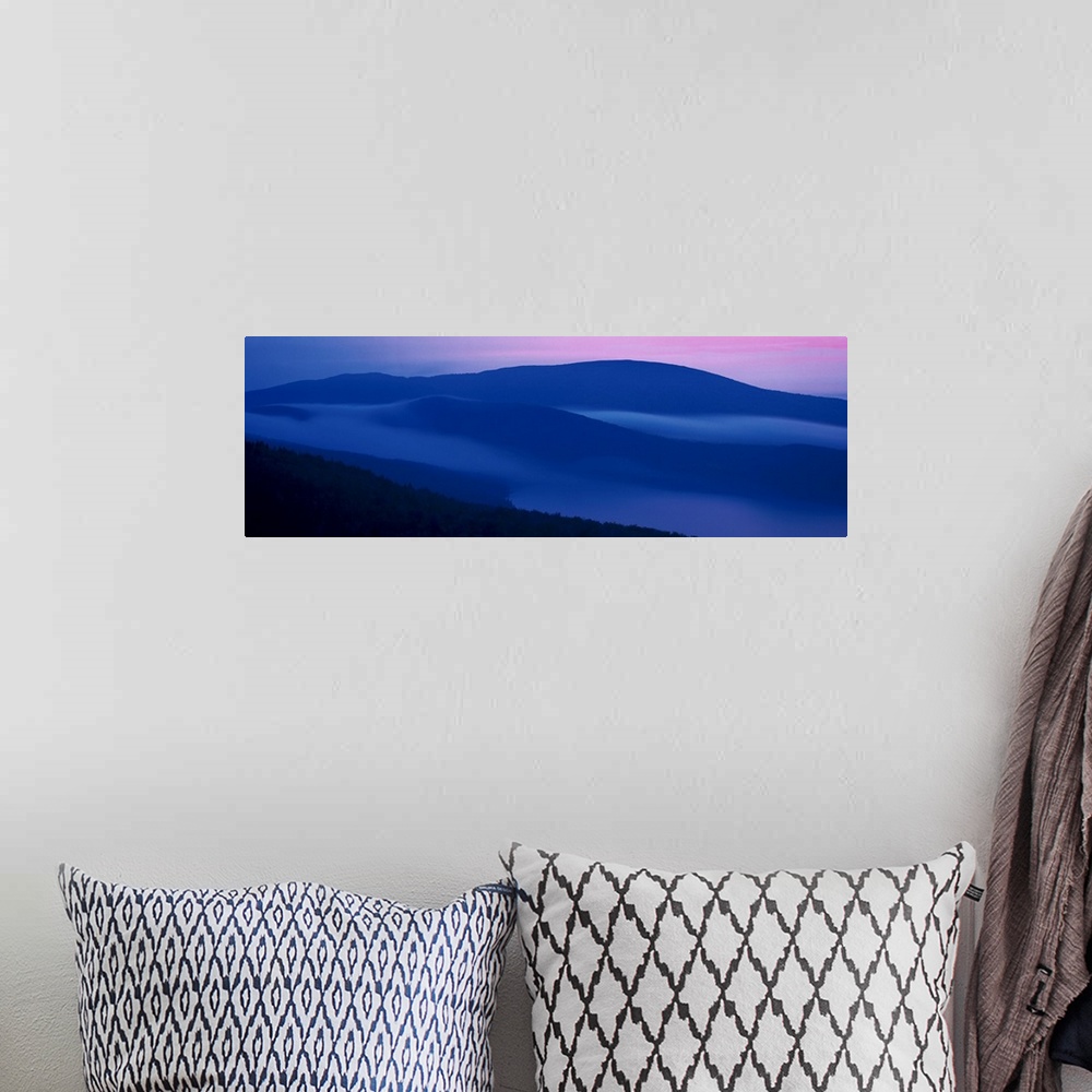 A bohemian room featuring Panoramic photograph on a big wall hanging of shadowed mountains at sunset at Acadia National Par...