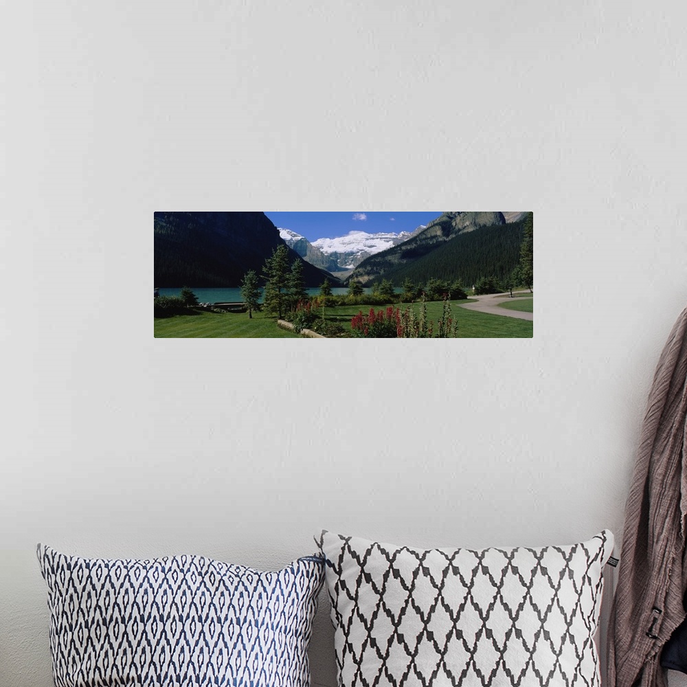 A bohemian room featuring Mountains surrounding a lake, Lake Louise, Canadian Rockies, Alberta, Canada