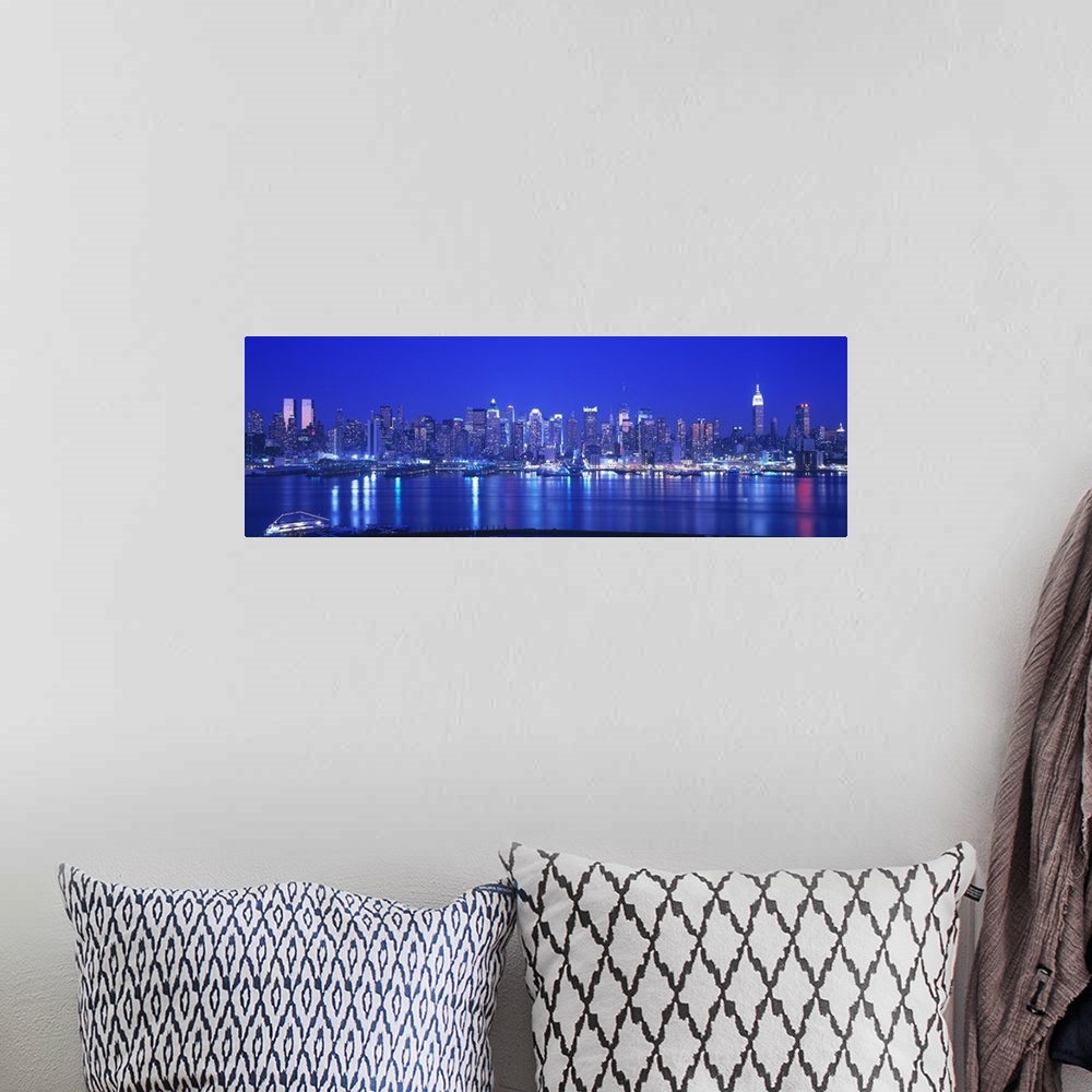 A bohemian room featuring Panoramic photograph at nighttime shows the illuminated skyline for the city nicknamed ""The Big ...