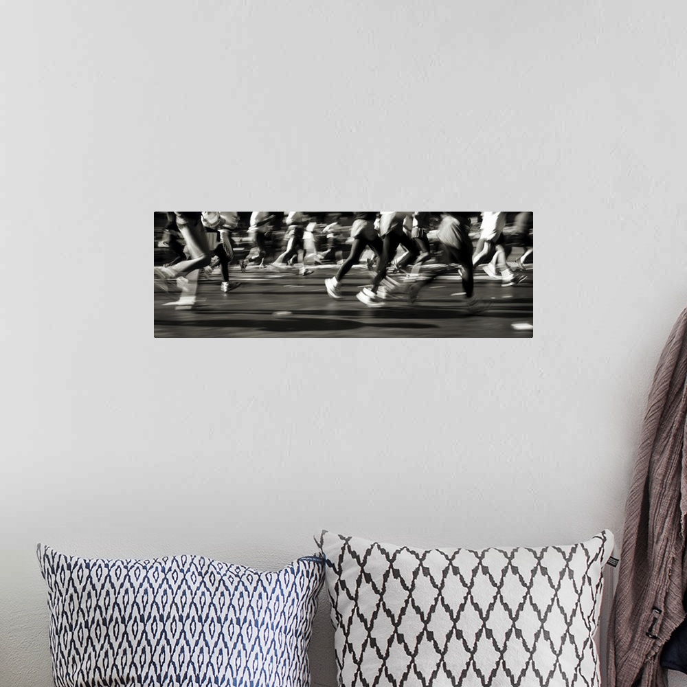 A bohemian room featuring Large, horizontal photograph of many runners from their waists down, running in a blur in the New...