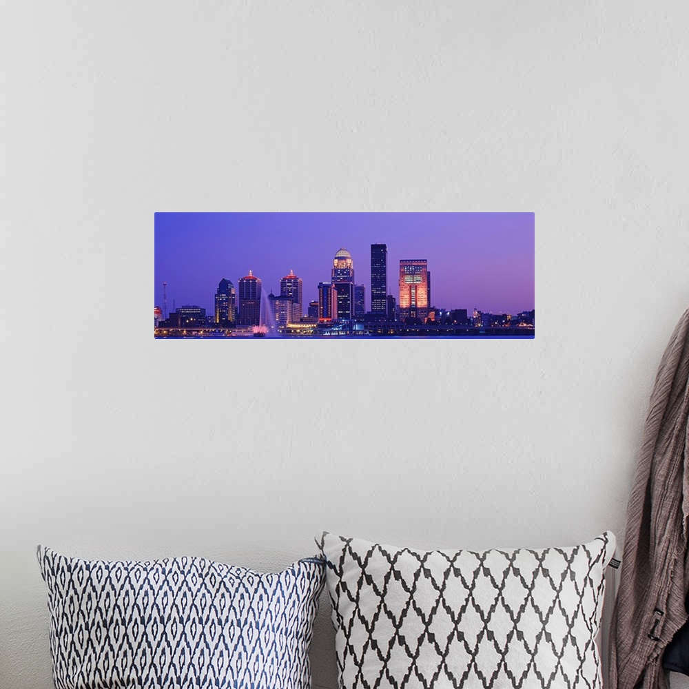 A bohemian room featuring Panoramic photo on canvas of a cityscape in Kentucky lit up at night along a waterfront.