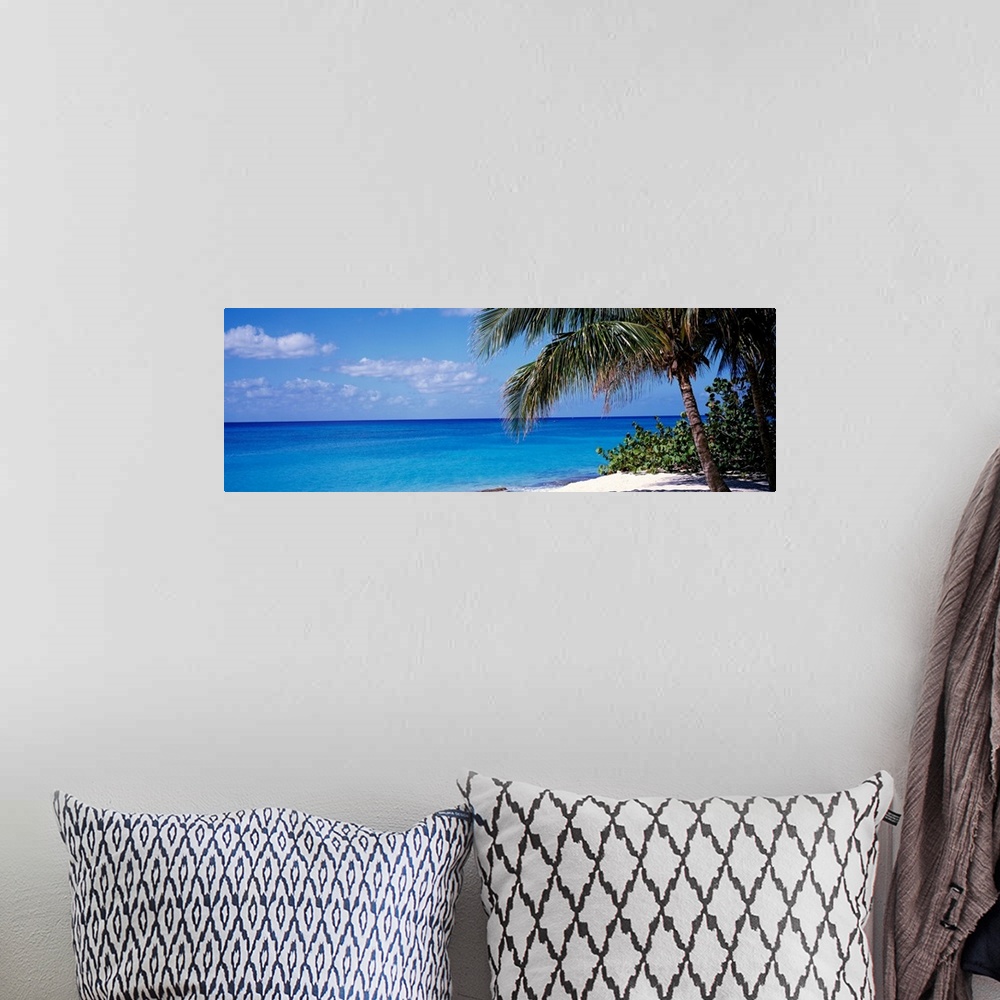 A bohemian room featuring Wall art for the home or office this panoramic photograph captures a still sea with minimal cloud...