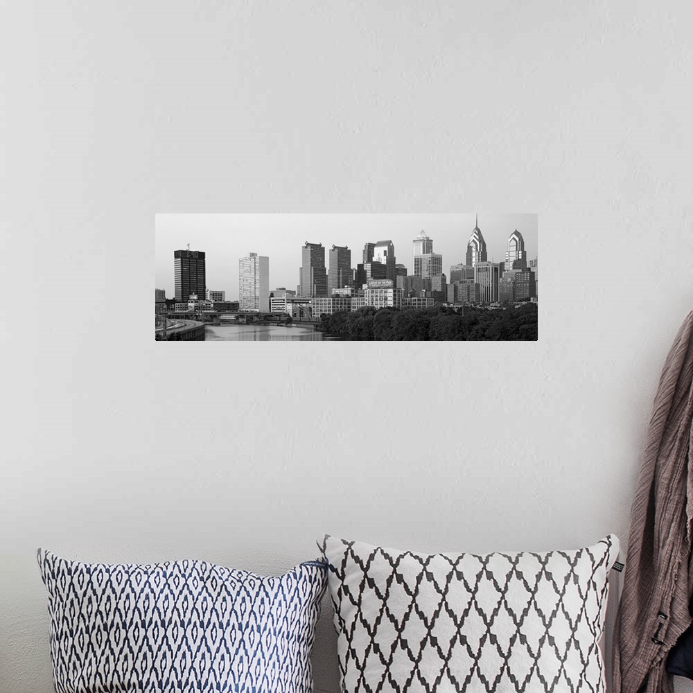A bohemian room featuring Panoramic photograph taken in black and white of the skyline in Philadelphia. A highway is seen t...