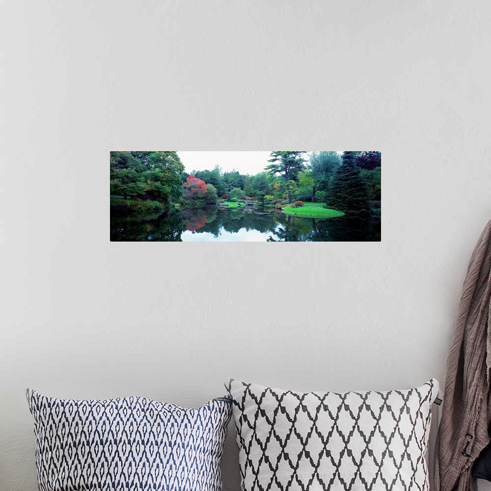 A bohemian room featuring Panoramic photograph of the vibrant Asticou Azalea Garden reflecting in the water of a large pond...