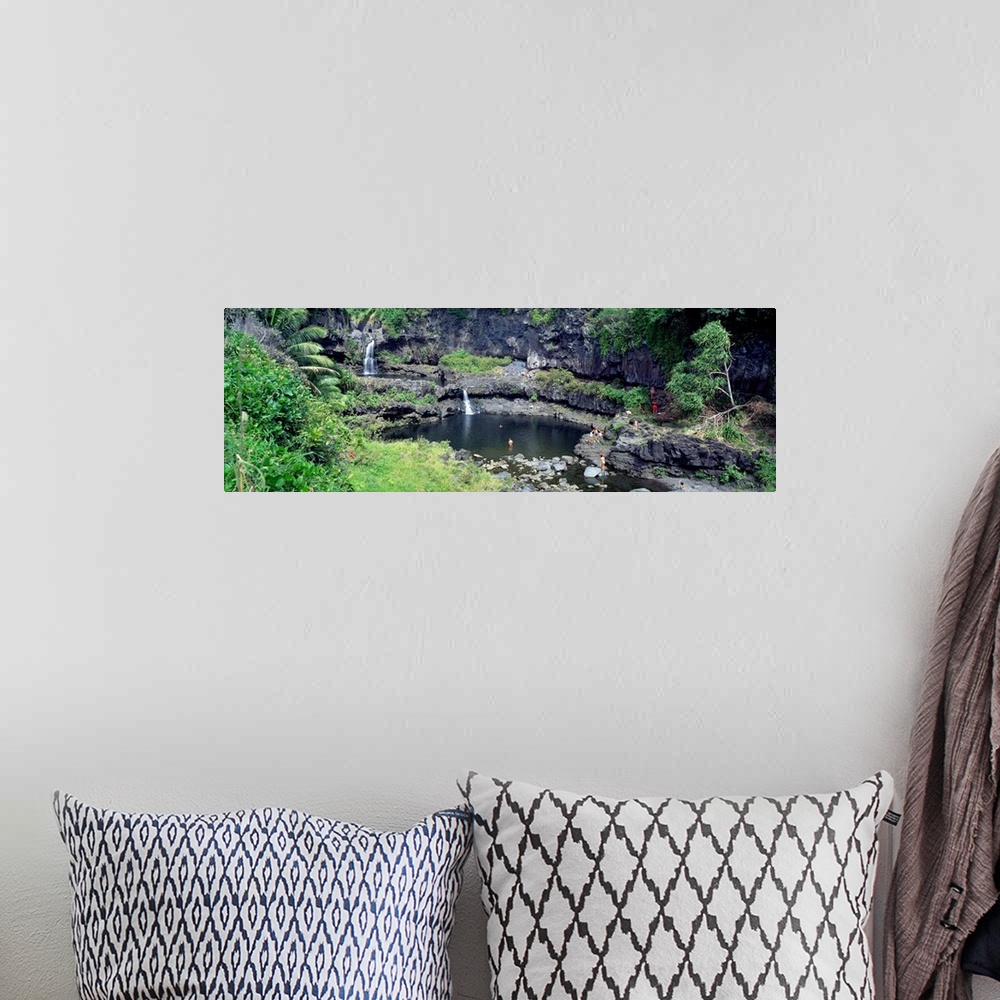 A bohemian room featuring This large panoramic piece is a photograph taken of small waterfalls that go into a pool of water...