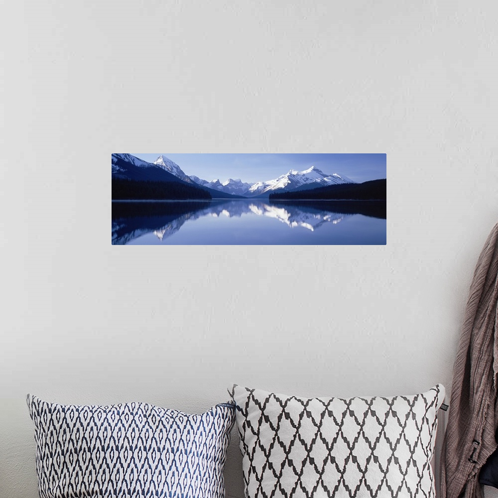 A bohemian room featuring Reflection of mountains in a lake, Maligne Lake, Jasper National Park, Alberta, Canada
