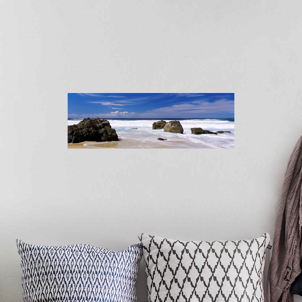 A bohemian room featuring Panoramic photograph of large boulders sitting on a beach in Big Sur, California (CA) on a sunny ...