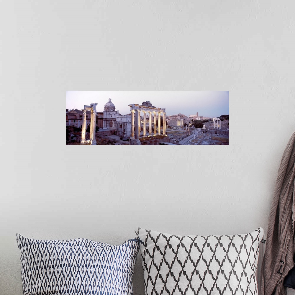 A bohemian room featuring Panoramic photograph of historic ruins with crumbling and eroded stone pillars and buildings.