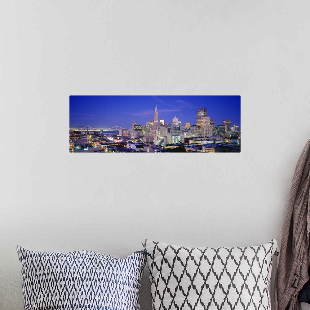 A bohemian room featuring Panoramic photograph taken from an aerial view shows the busy skyline of a city in California shi...