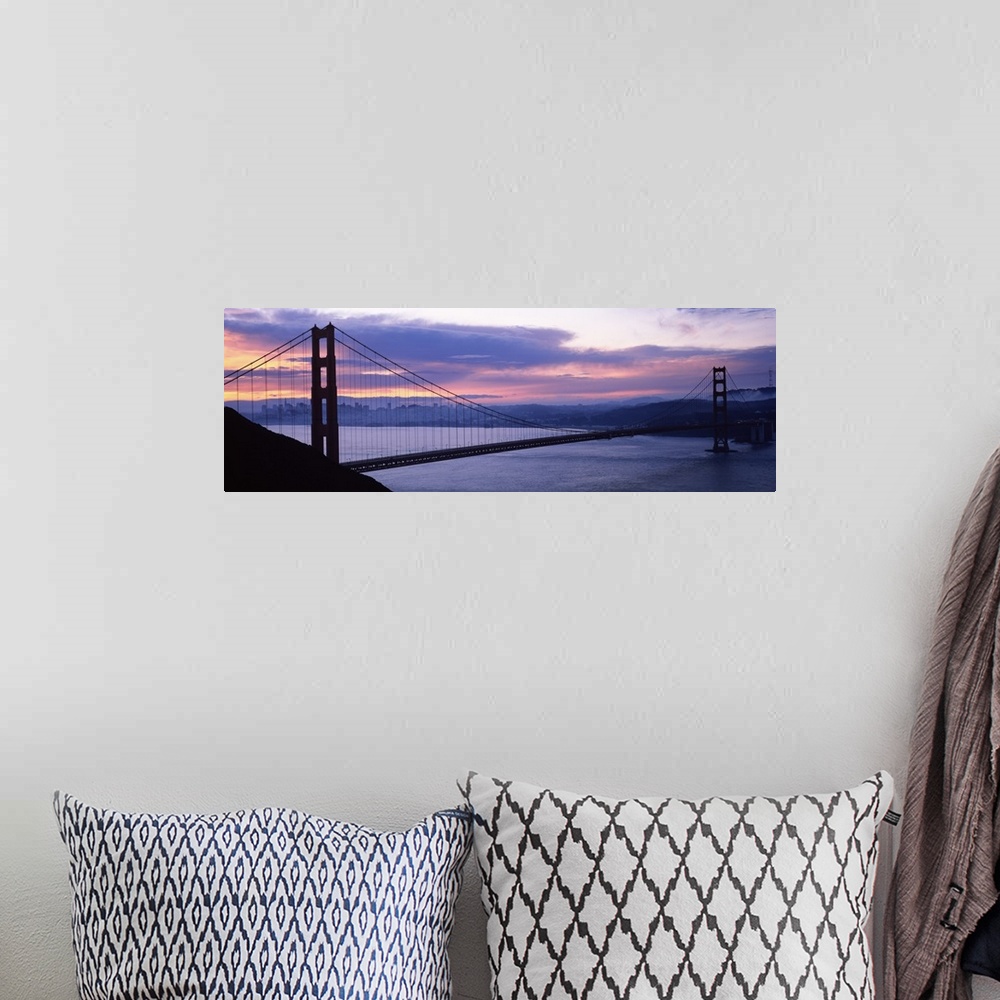 A bohemian room featuring Silhouette of a suspension bridge at dusk, Golden Gate Bridge, San Francisco, California,