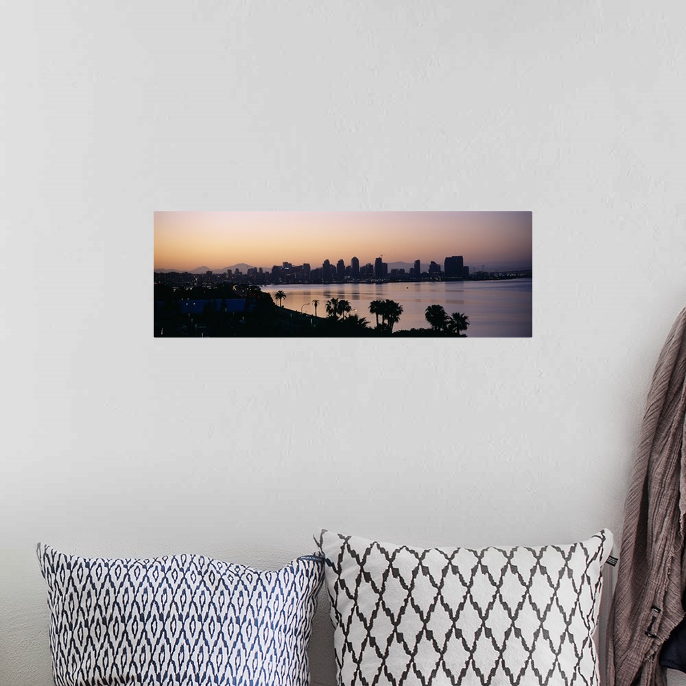 A bohemian room featuring Panoramic photograph taken from an aerial view overlooking the distant skyline of a busy city sit...