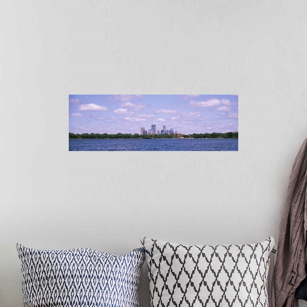 A bohemian room featuring Panorama depicting Minneapolis downtown with a cloud-filled sky and a view of Chain of Lakes Park...