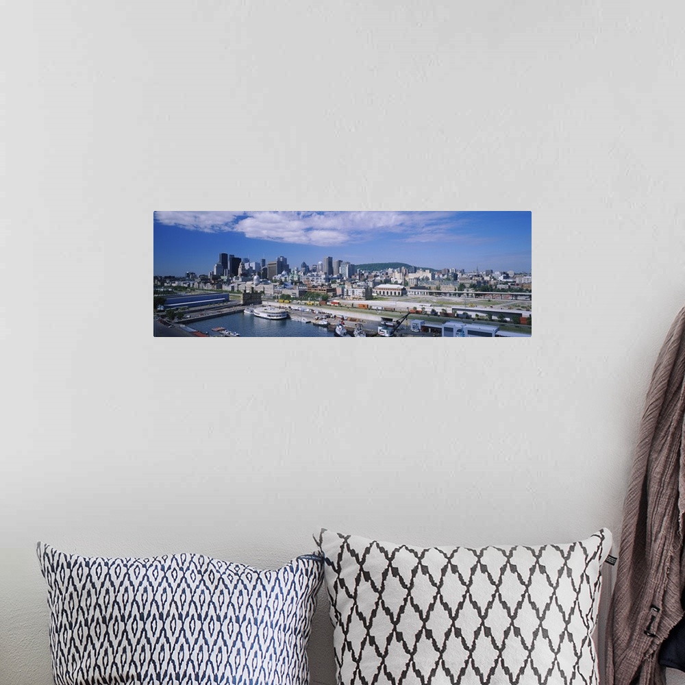 A bohemian room featuring Panoramic photograph of many buildings along the shoreline of Old Port in Montreal, Quebec, Canad...