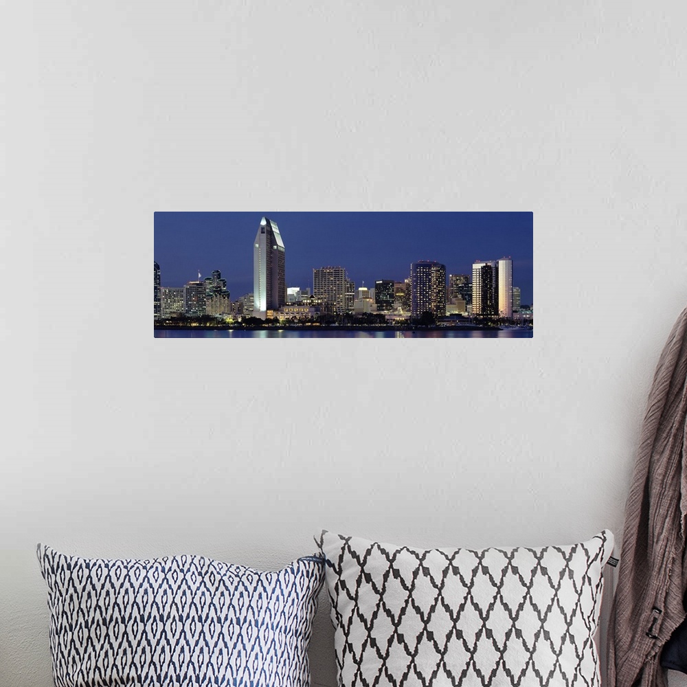 A bohemian room featuring This large panoramic photograph is of the San Diego skyline at night with all of the buildings li...