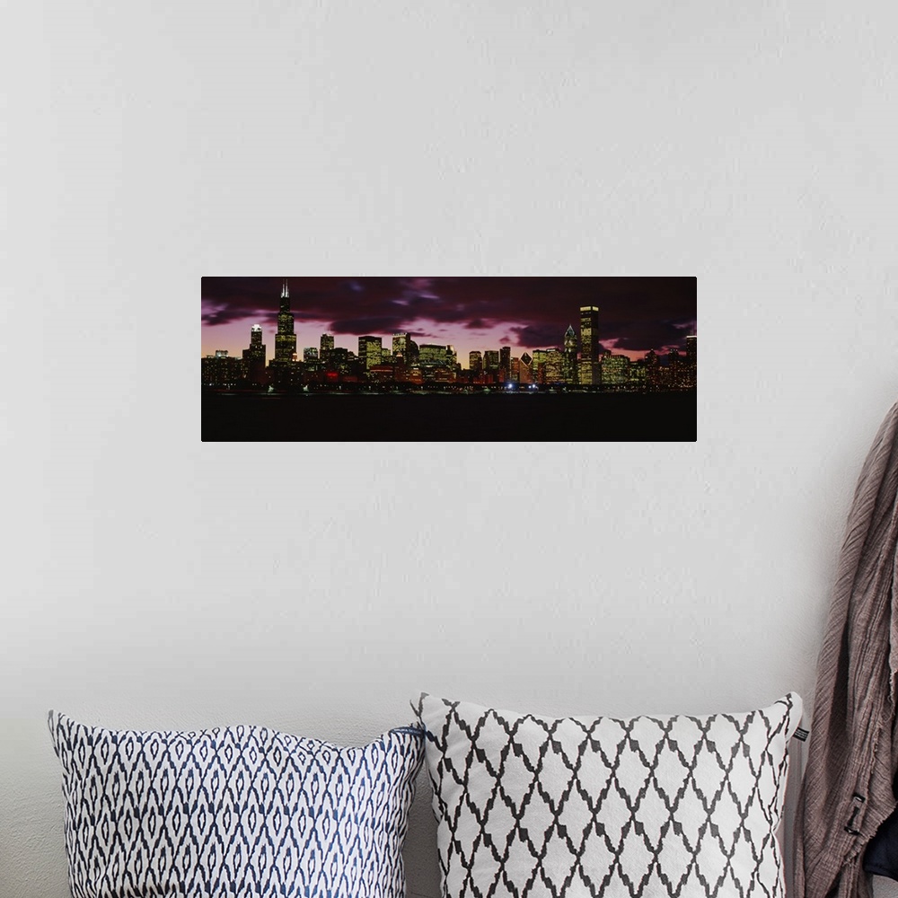 A bohemian room featuring Wide angle photograph of the Chicago, Illinois skyline at night with brightly lit buildings again...