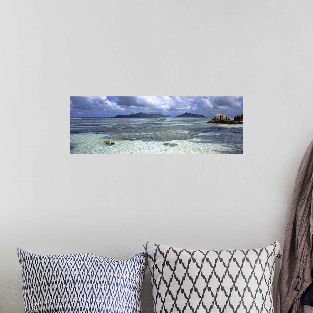 A bohemian room featuring Snorkeler in the waters of Anse Source d'Argent beach, La Digue Island, Seychelles