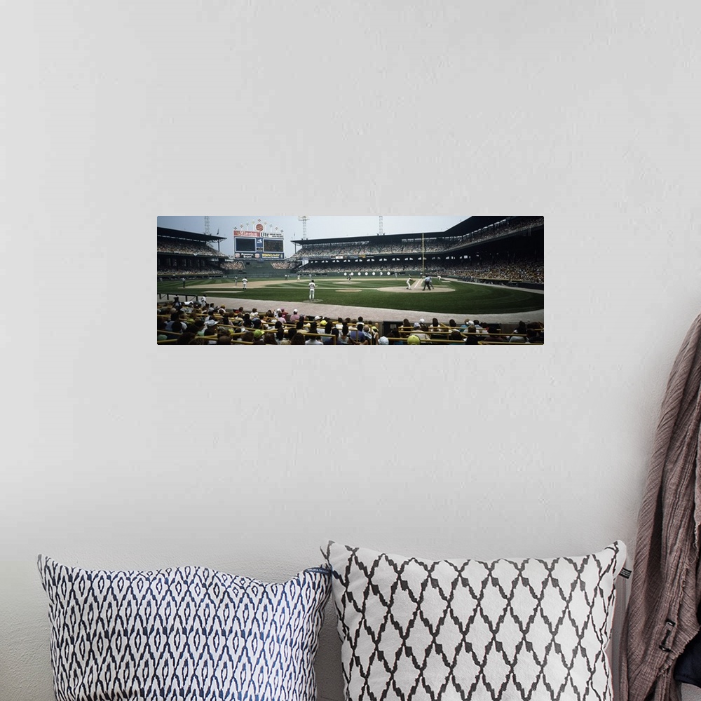A bohemian room featuring Panoramic image of people watching a baseball game seen at field level.