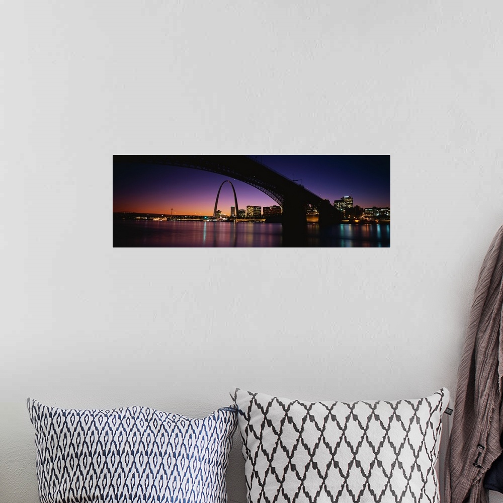 A bohemian room featuring A dramatic panorama of downtown St. Louis including bridges, the arch and sunset.