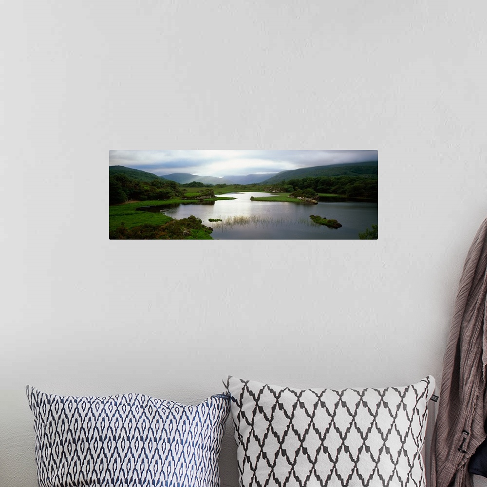 A bohemian room featuring Sunlight on water, distant mountains in mist, Ireland