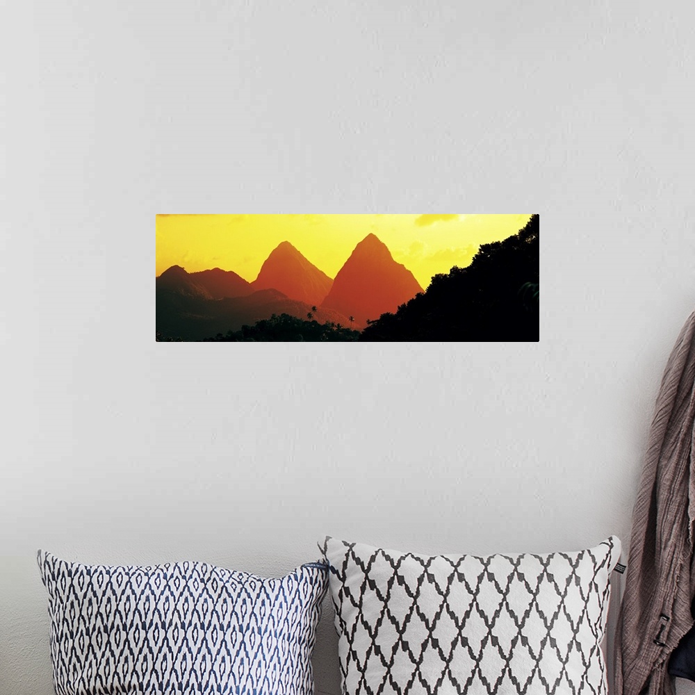 A bohemian room featuring Panoramic photograph of mountain silhouettes with forest tree tops in the foreground.