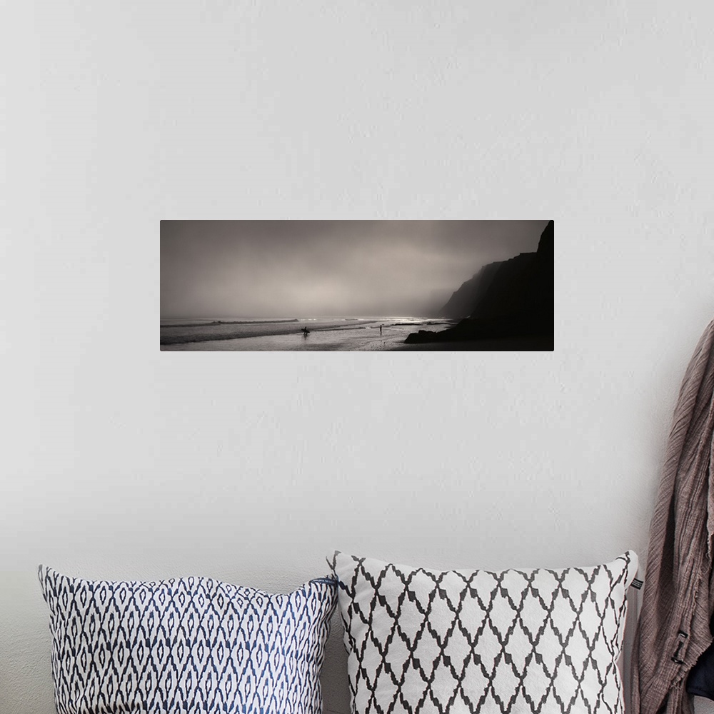 A bohemian room featuring Panoramic photograph on a giant canvas of a dark, foggy sky over Point Reyes National Seashore, w...