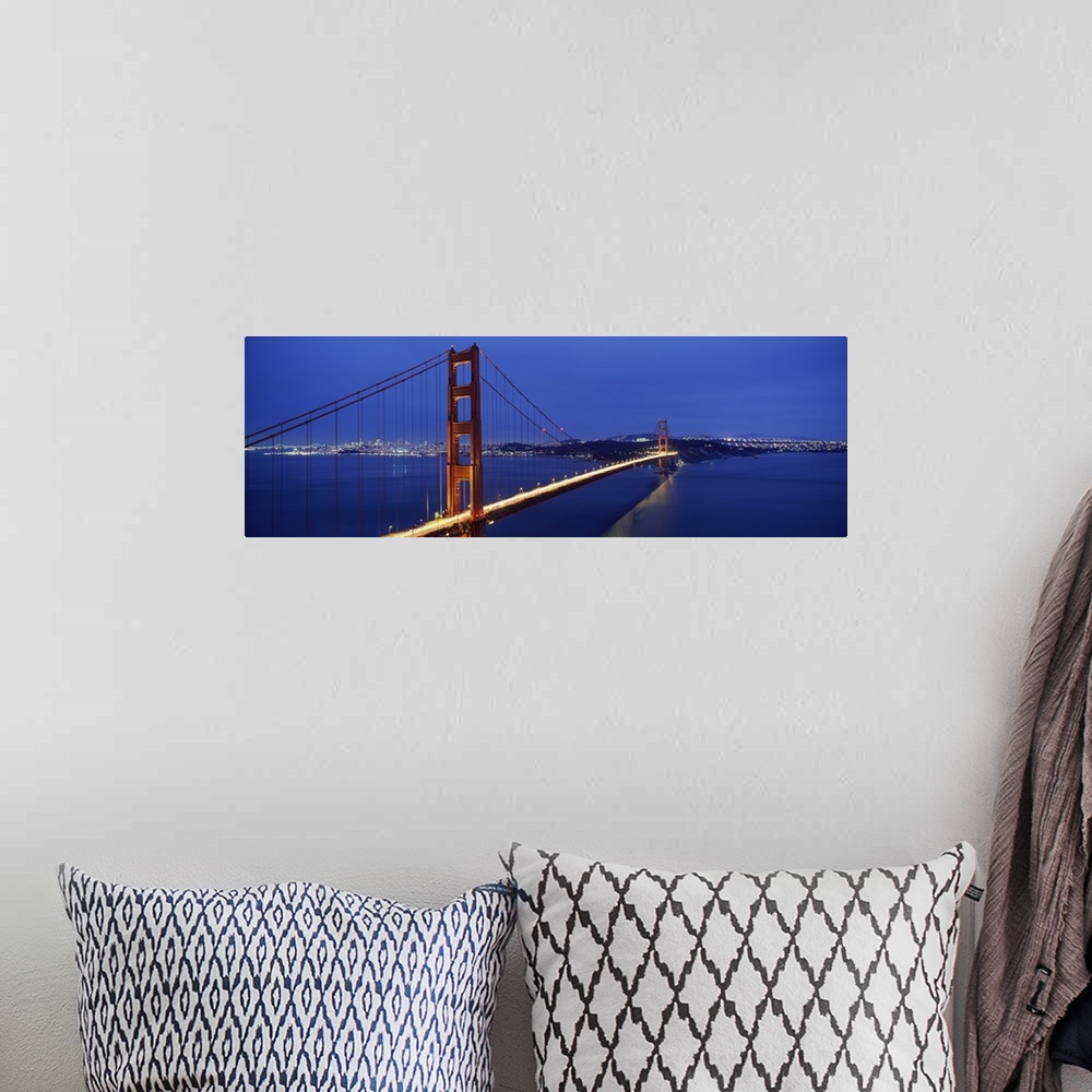 A bohemian room featuring Panoramic photo of a bridge spanning the bay, its famous red towers and cables standing out again...