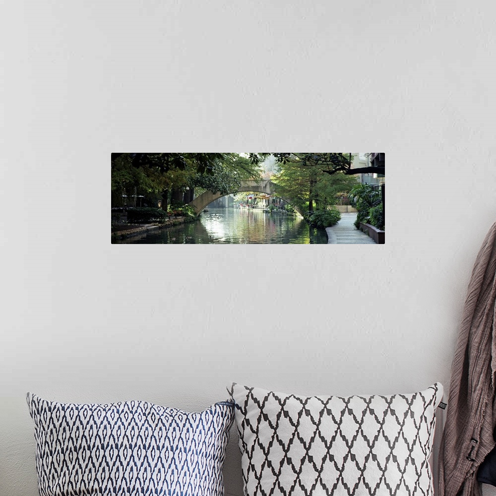 A bohemian room featuring Panoramic image of the canal in San Antonio with sidewalks, trees, and restaurants lining the wat...
