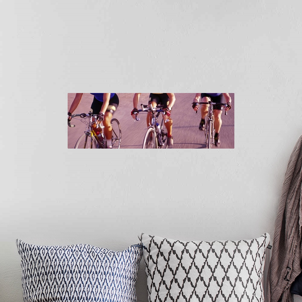 A bohemian room featuring Three women cycling