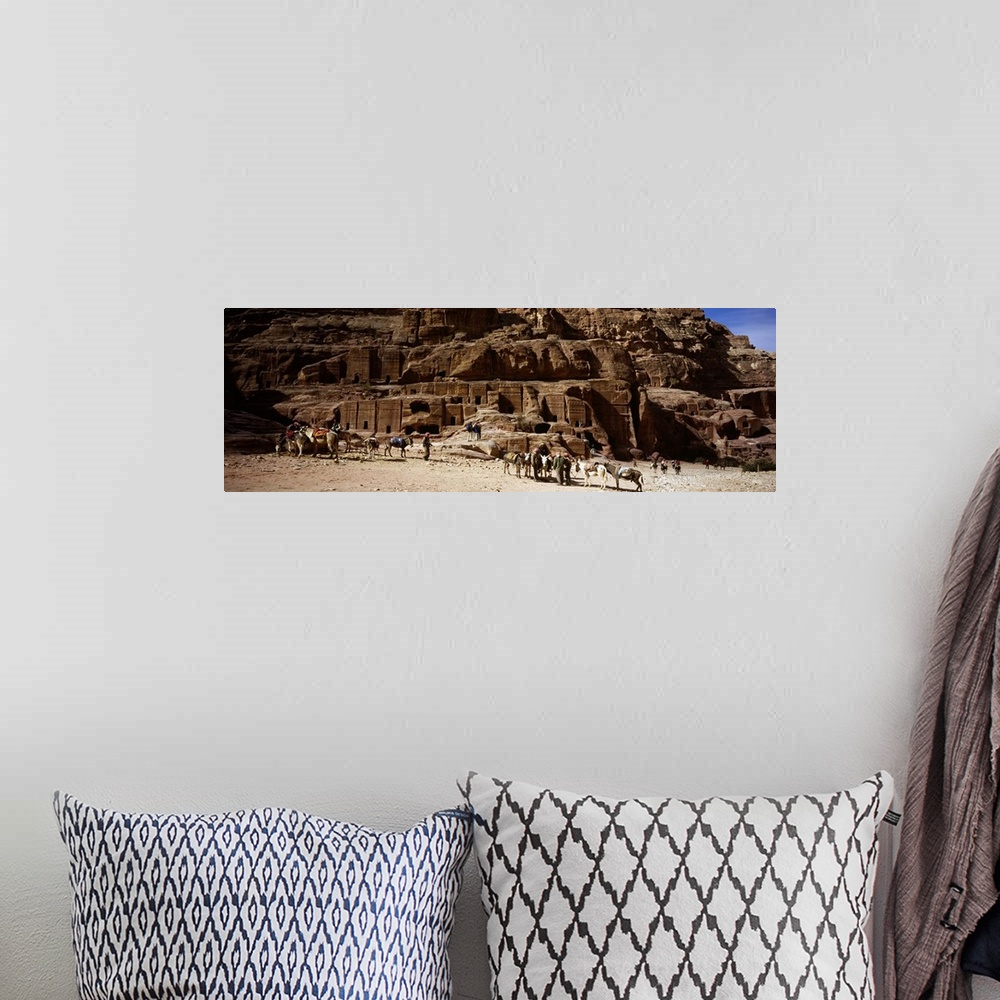 A bohemian room featuring Tourist at ancient structures, Petra, Jordan