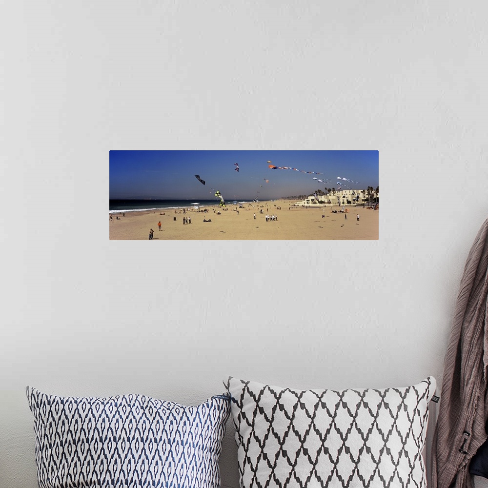A bohemian room featuring Tourists on the beach Huntington Beach Orange County California