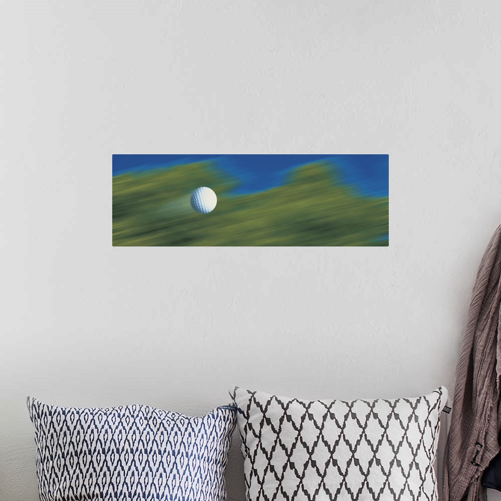 A bohemian room featuring This decorative accent for the home or office of a golf enthusiast shows a golf ball speeding thr...